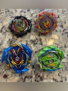Four-Piece Beyblade Spinning Battle Tops Lot